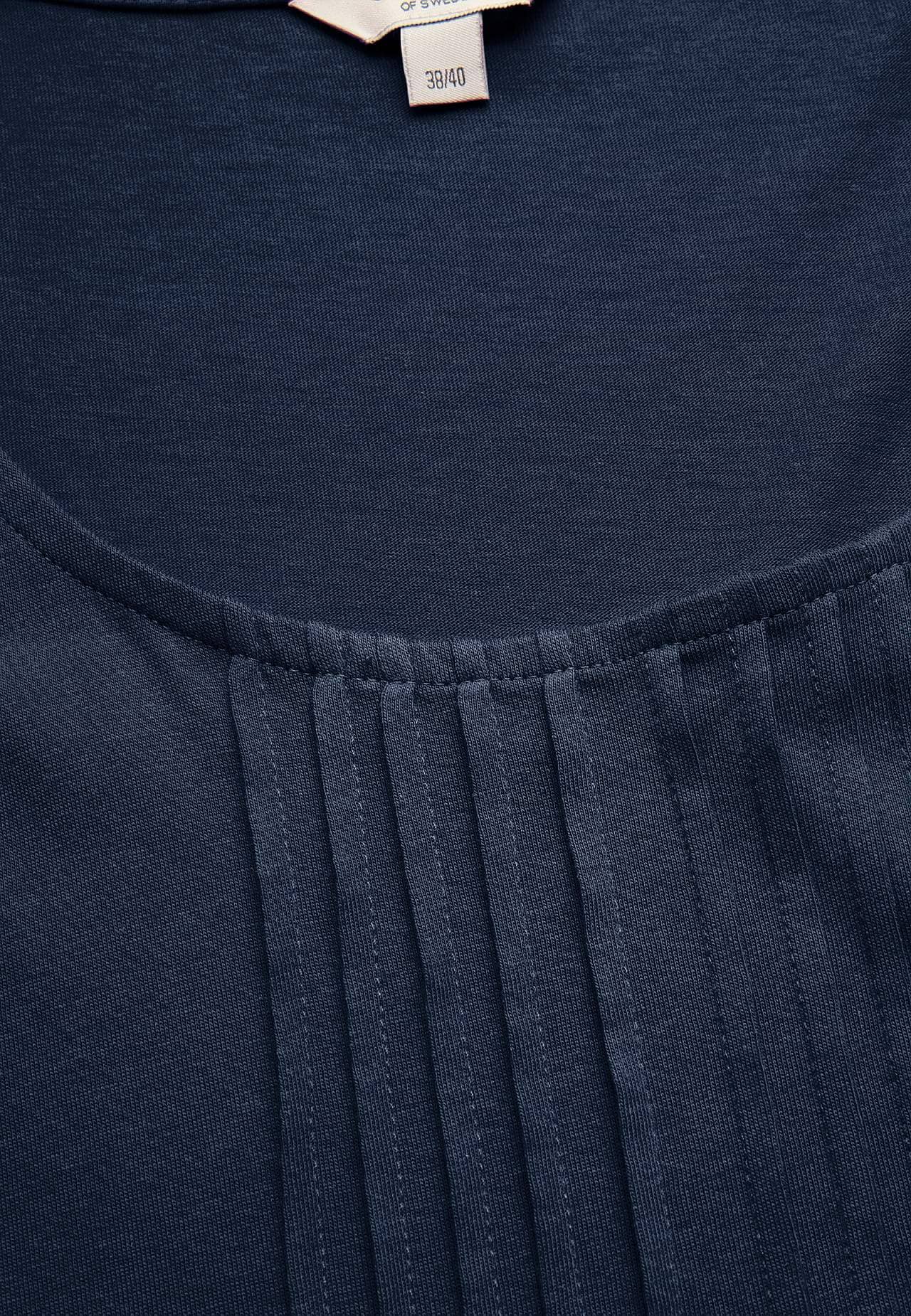 Singlet med dekorativ fold