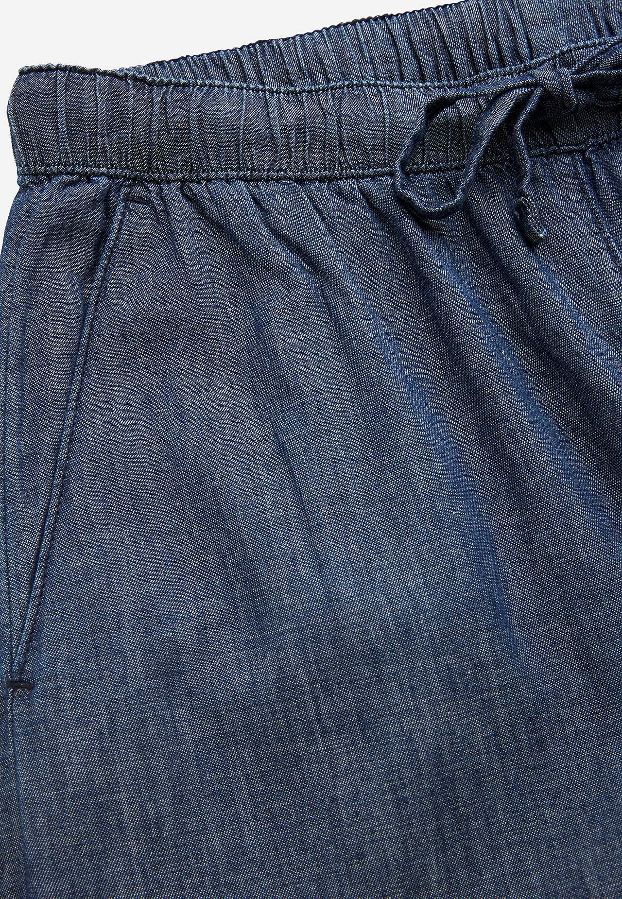 Bukse i denim med vide ben
