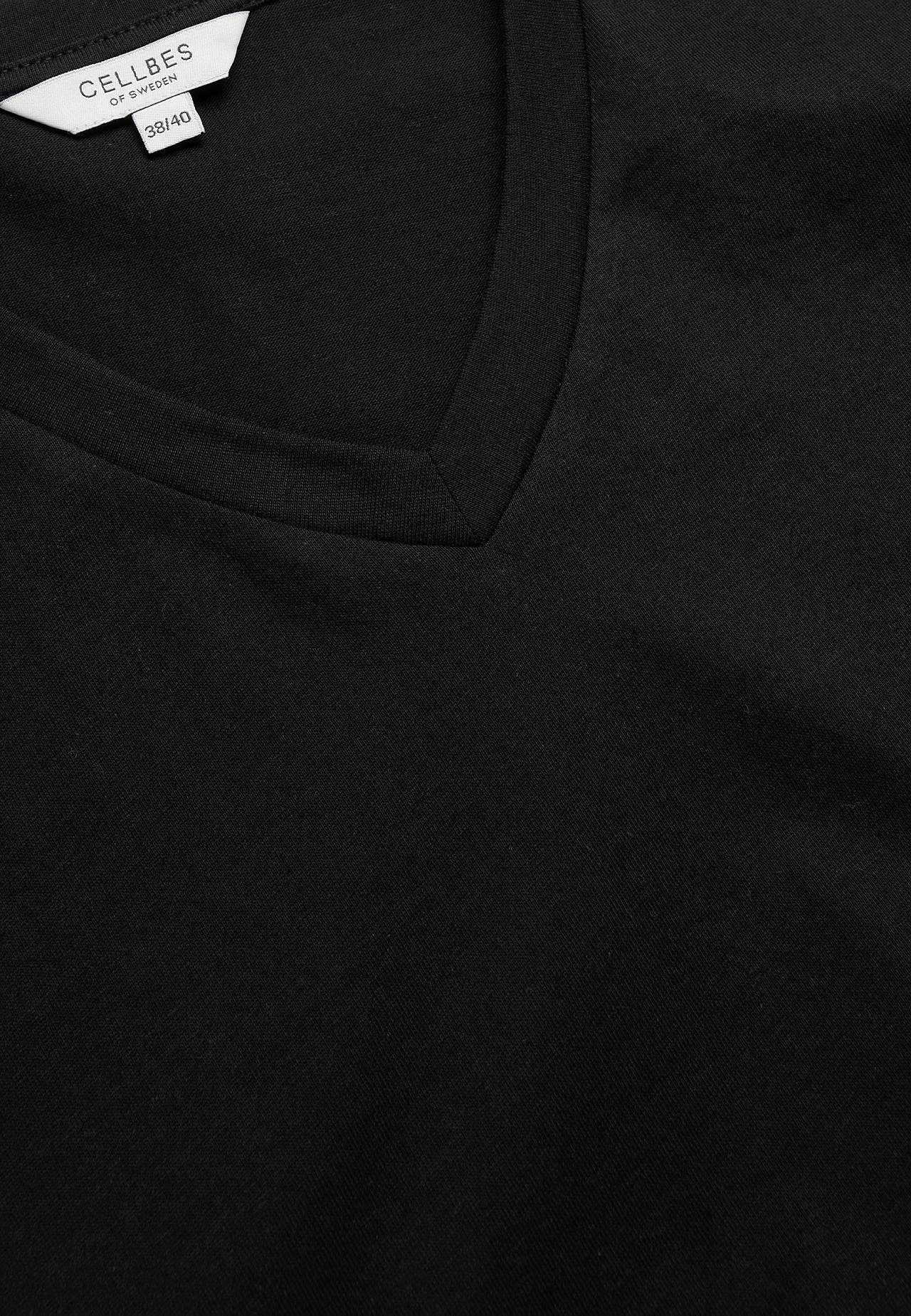 Jerseytopp med korte, oppbrettede ermer