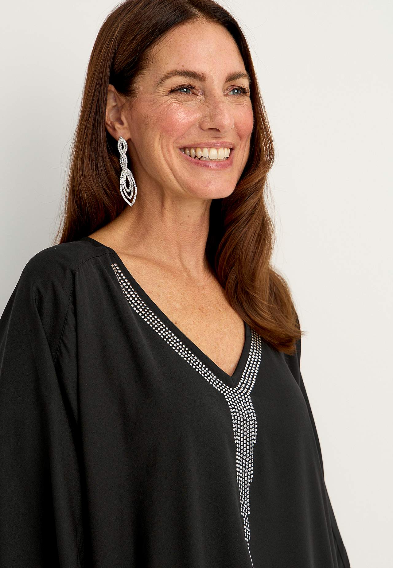 Festbluse med stiftdetaljer