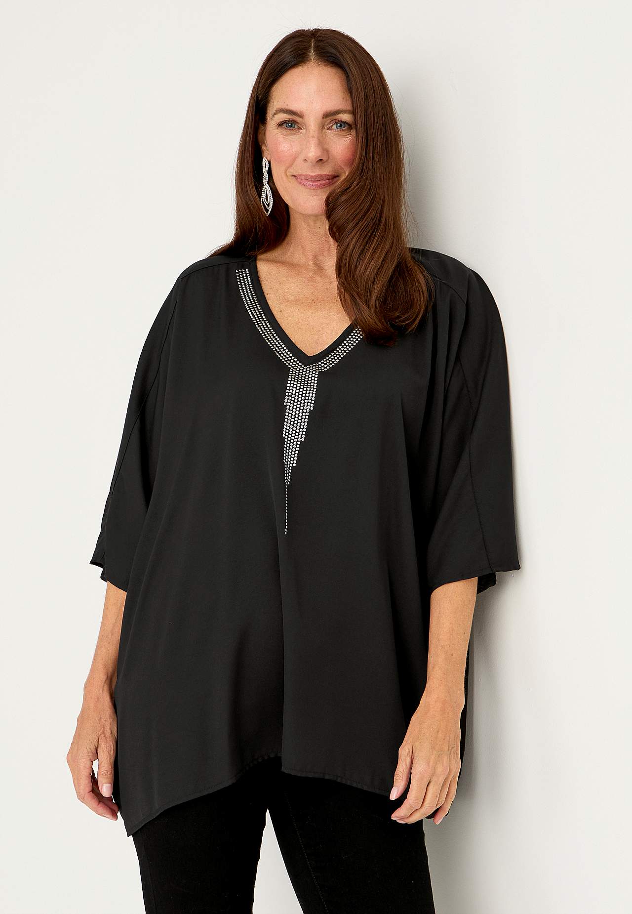 Festbluse med stiftdetaljer