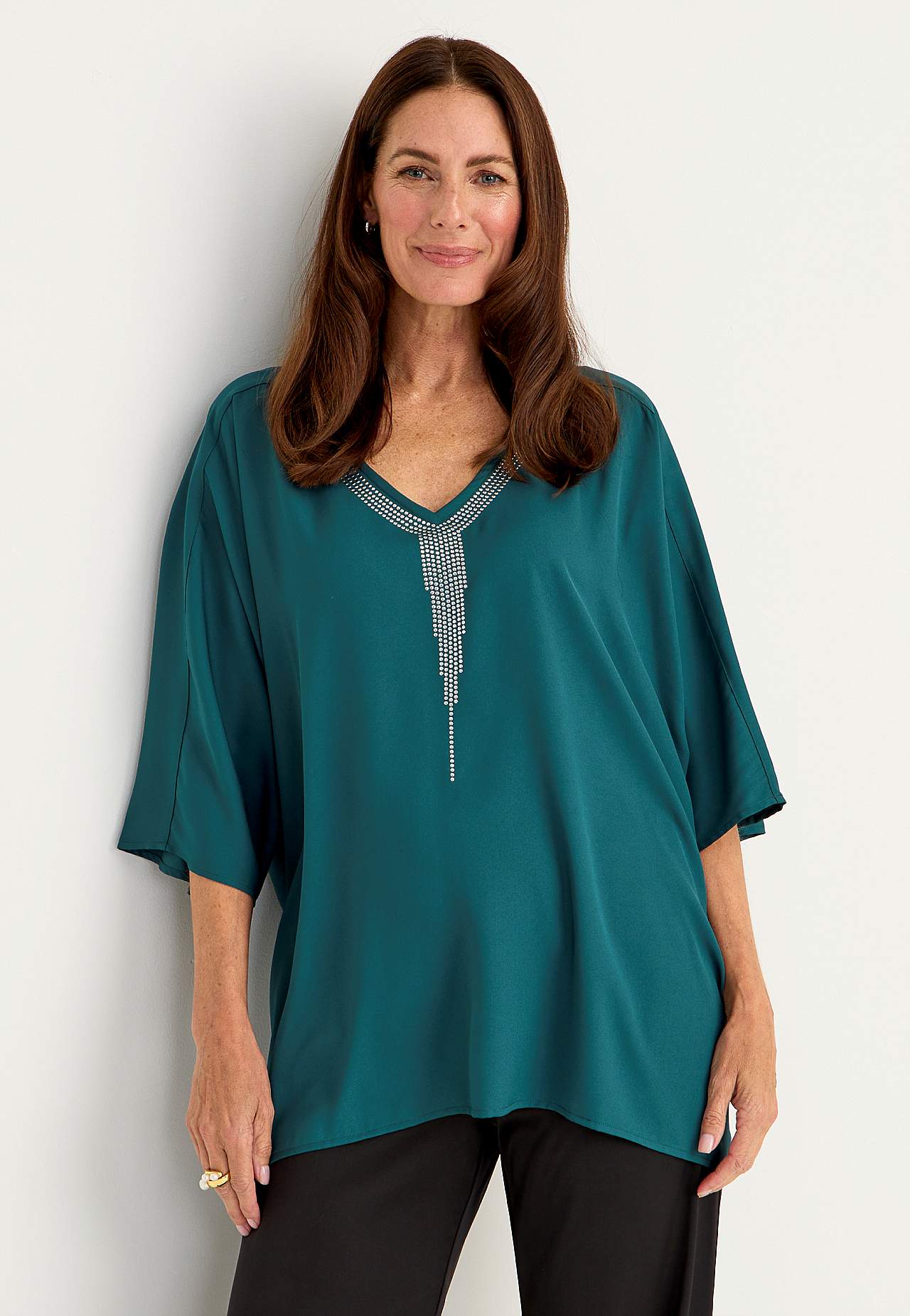 Festbluse med stiftdetaljer