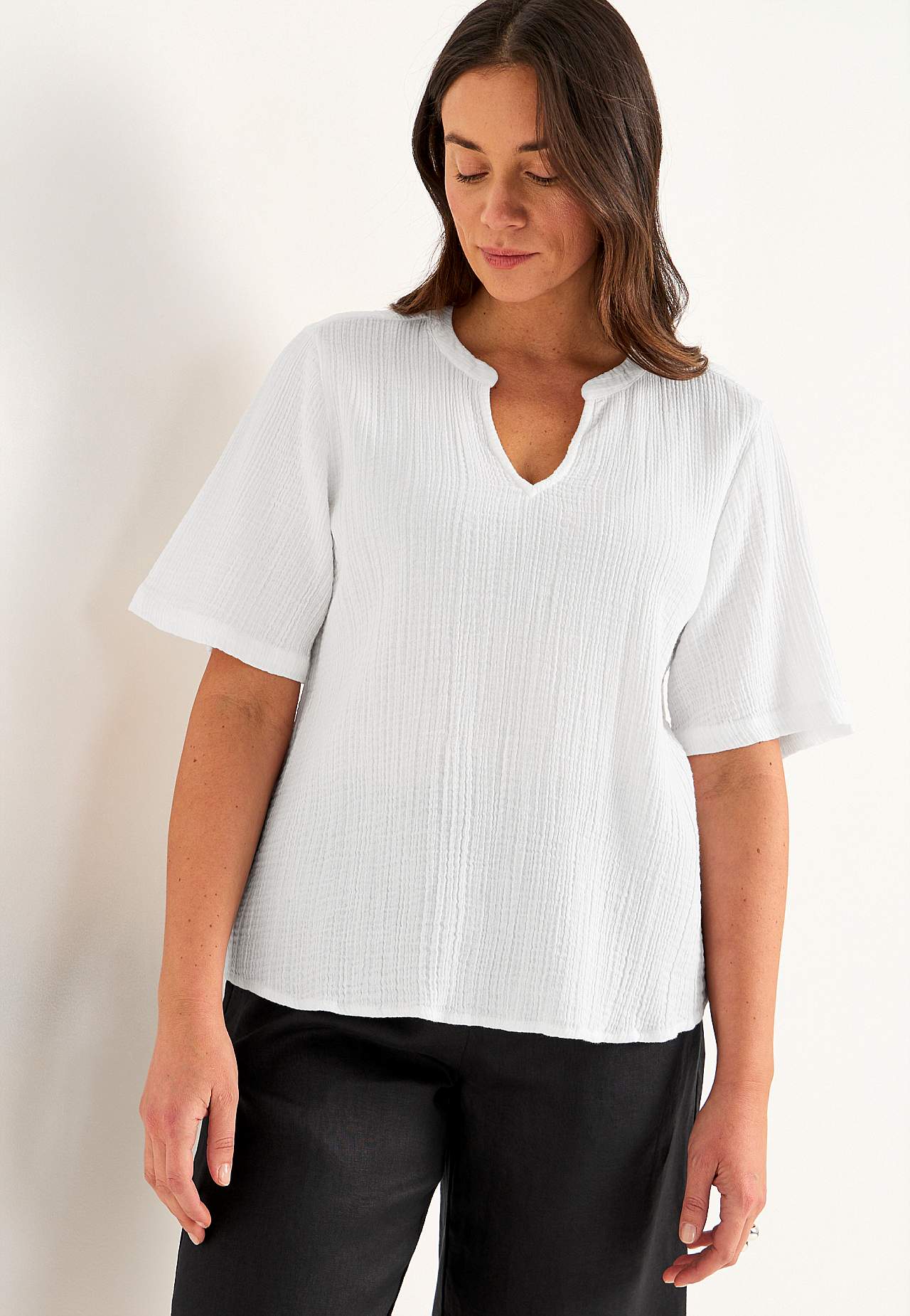 Bluse i rynket bomull