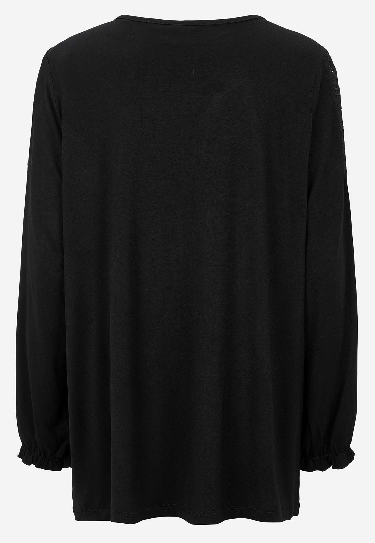 Jerseytopp med blondedetaljer på ermene