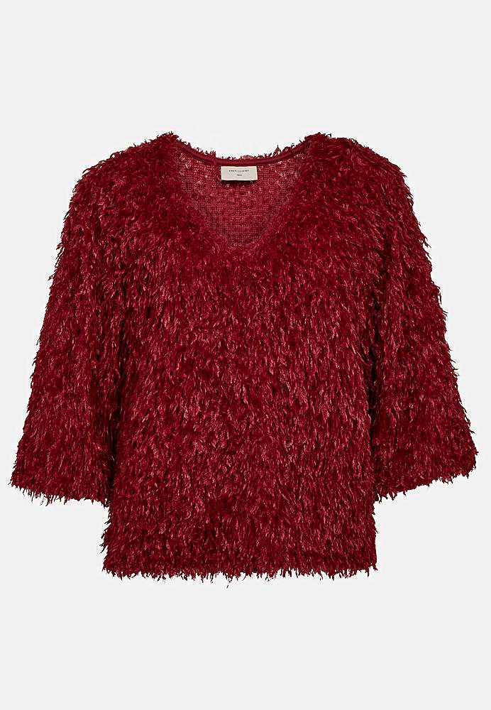 Festtopp med fjærlignende materiale