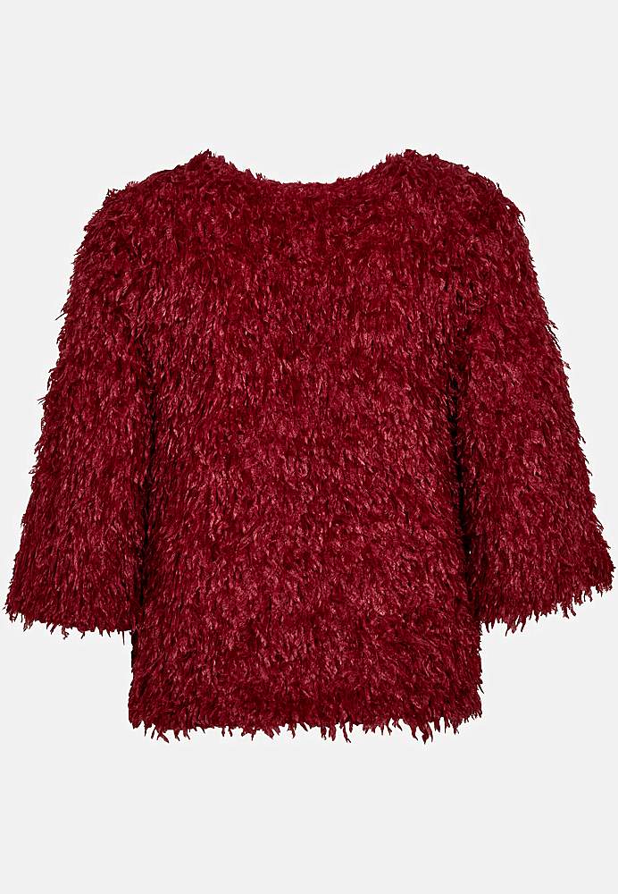 Festtopp med fjærlignende materiale